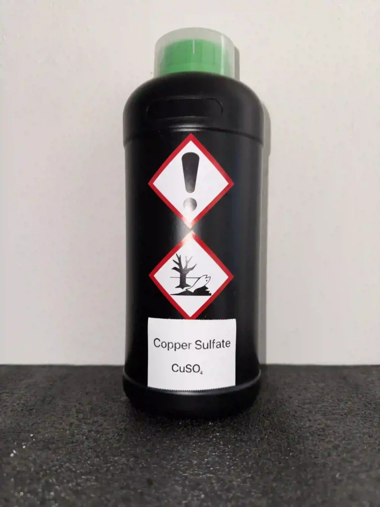 HDPE bottle of Copper Sulfate labeled with GHS icons: Irritant, Environmental